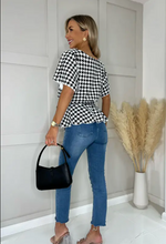 Ruby Houndstooth Batwing Peplum Top | 2